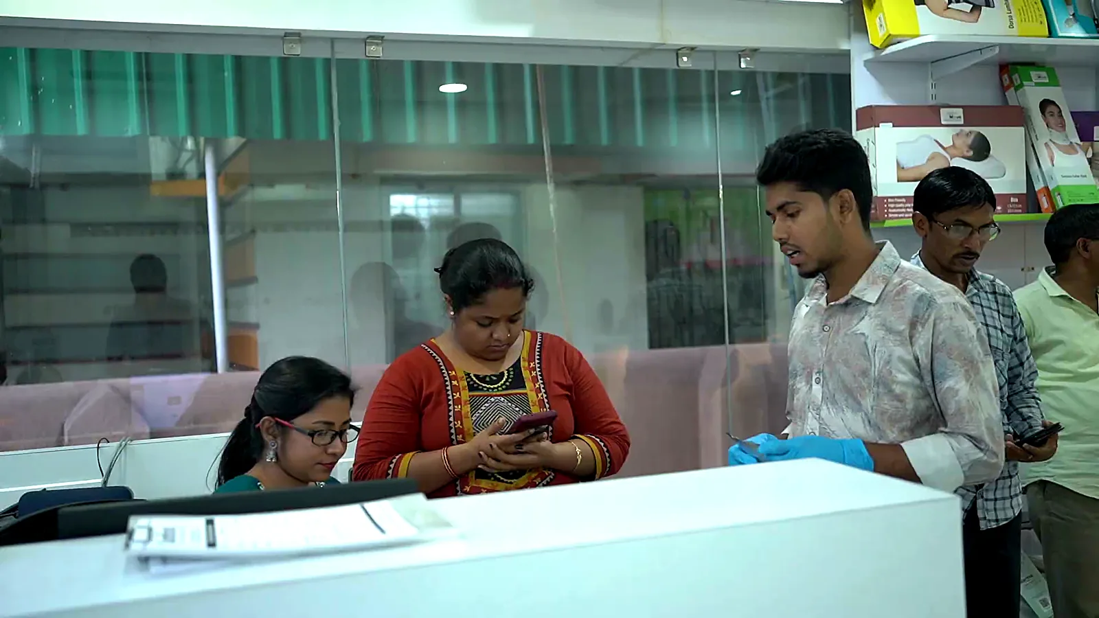 Patients at the CuraFoot clinic reception desk