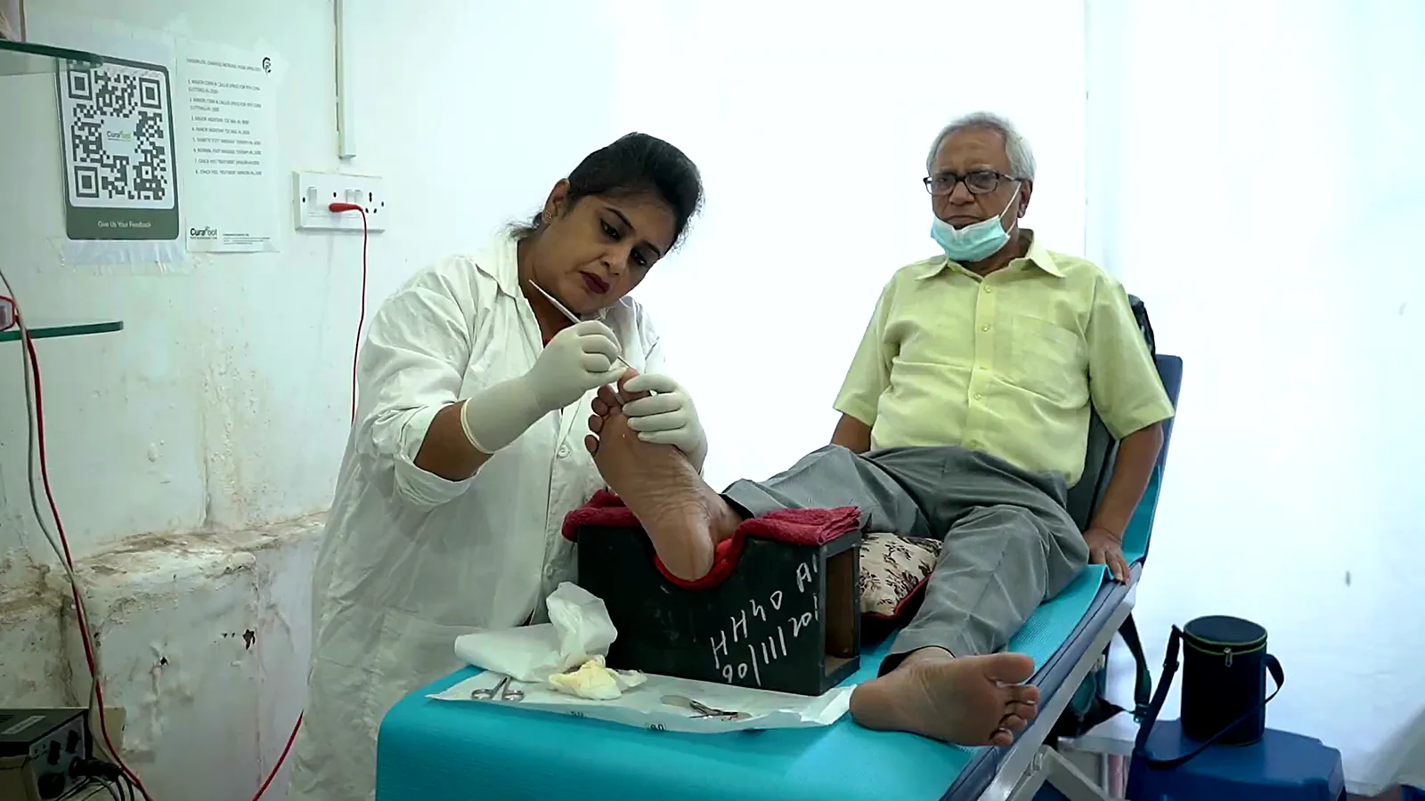 CuraFoot podiatrist treating a patient's foot