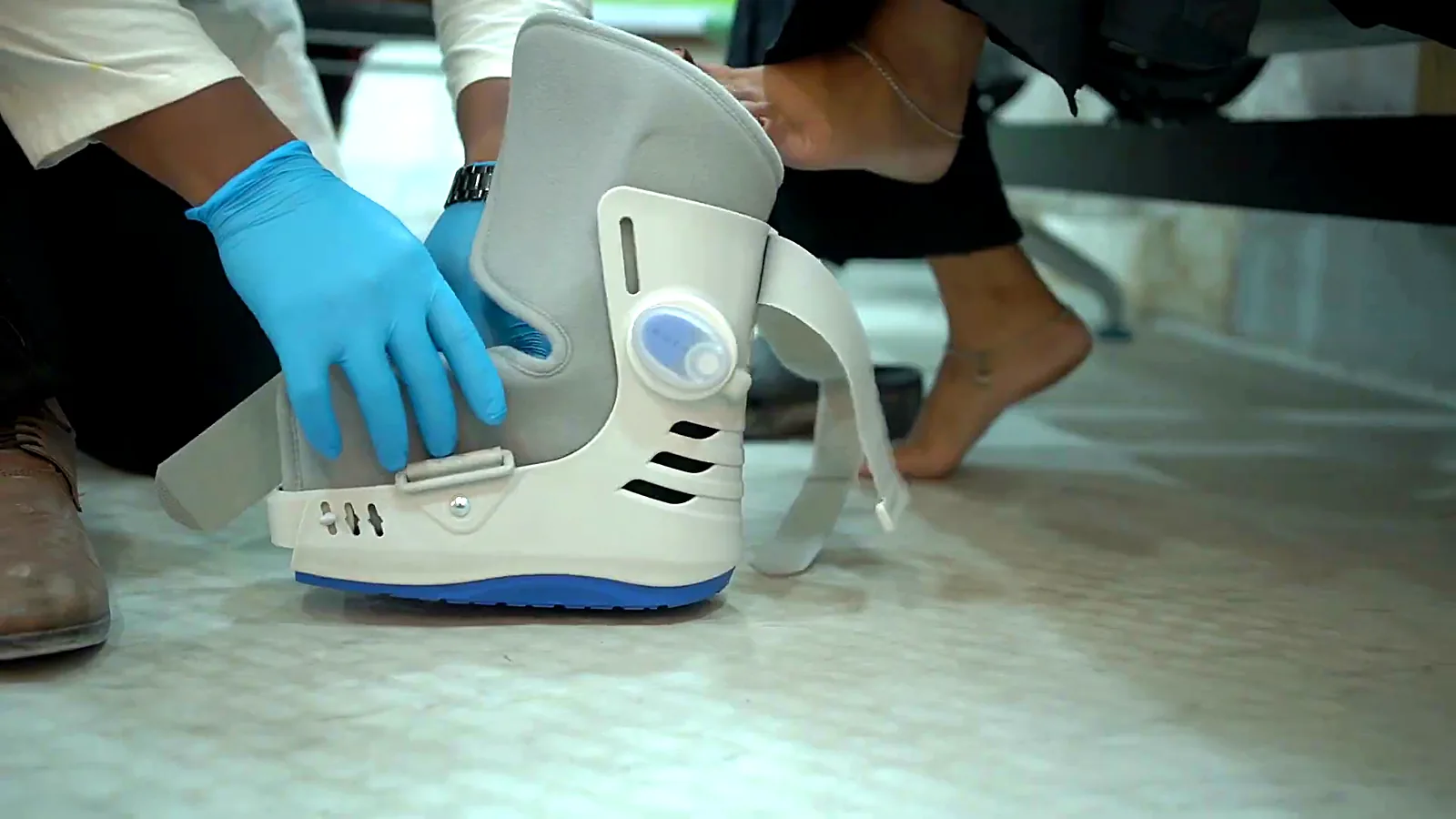 CuraFoot clinician fitting a walker boot