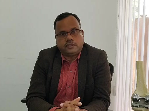 Dr Jayant Kumar Dash at his desk at DAshthetix, Bhubaneswar