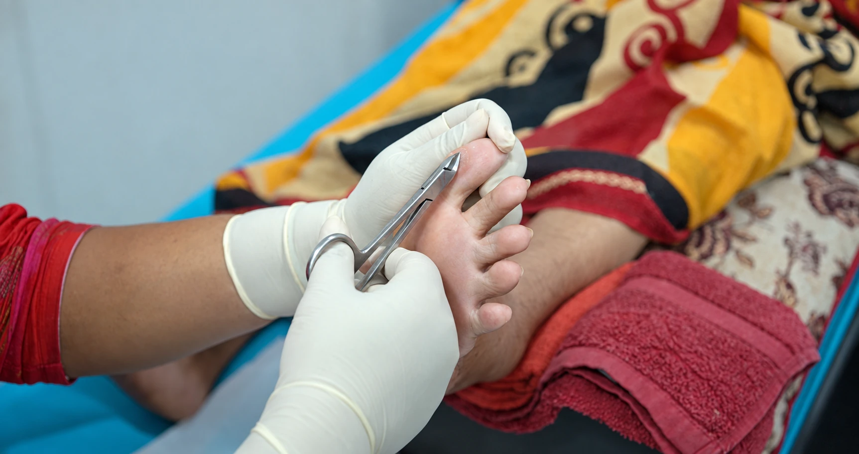 CuraFoot clinician assessing a patient's foot and footwear pressure